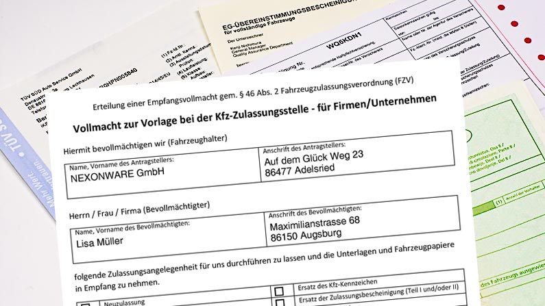 Auf Unterlagen für eine Kfz-Zulassung liegt eine Empfangsvollmacht zur Vorlage bei der Zulassungsstelle
